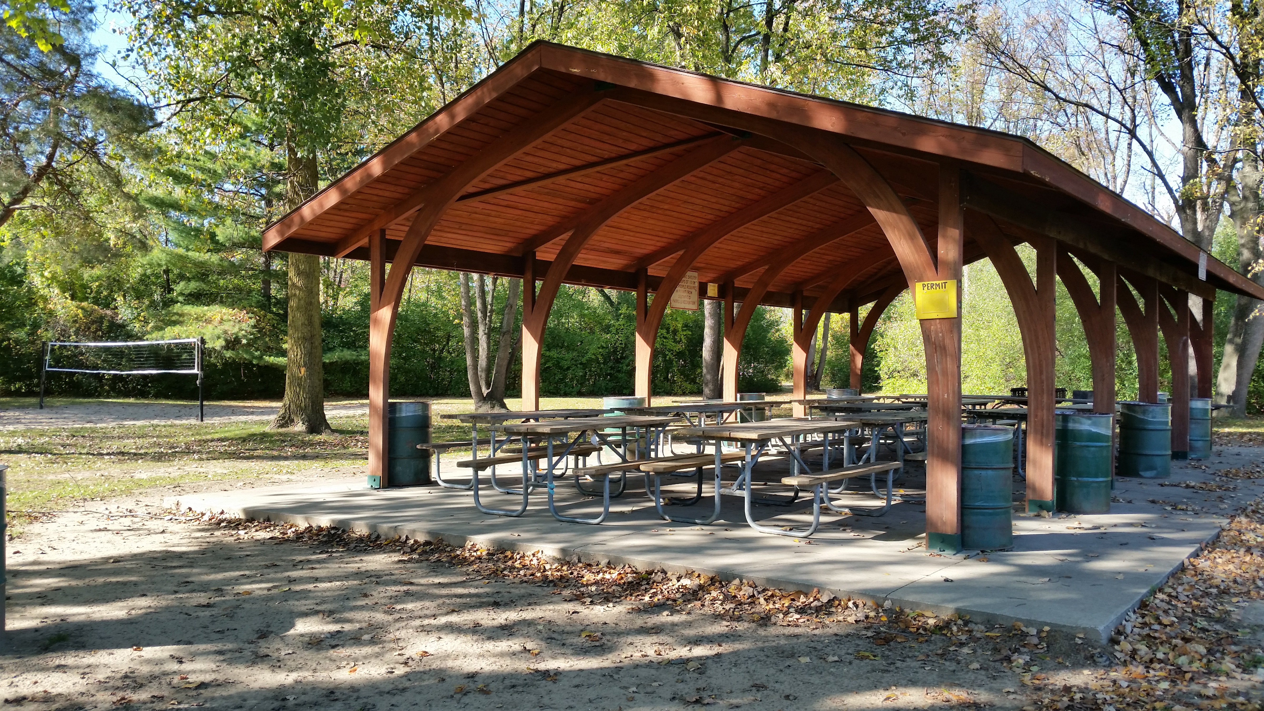 Beech Woods Park Shelter #1, $150 per day, capacity 65 guests with 12 picnic tables. Photos show the shelter located in the north portion of the park.