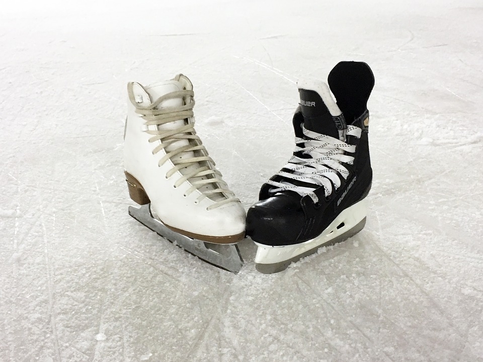 two ice skates sit on ice