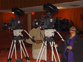 People shooting film in a red room